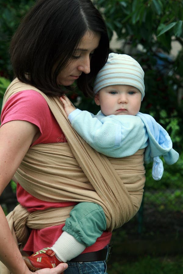 Baby with mom in sling stock image. Image of mommy, african 12397377