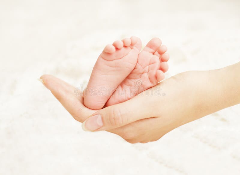 Baby Newborn Feet Mother Hands. New Born Kid Foot, Family Love