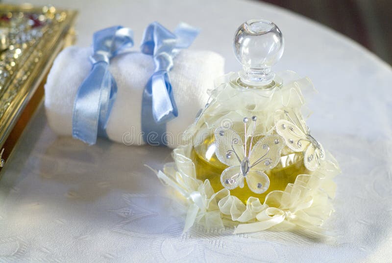 Baby oil for a baptism stock image. Image of small, table 6869479