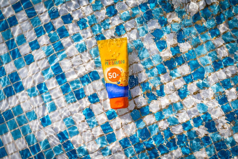 Baby Orange Sun Protection Cream Spf 50 Against a Background of Blue ...