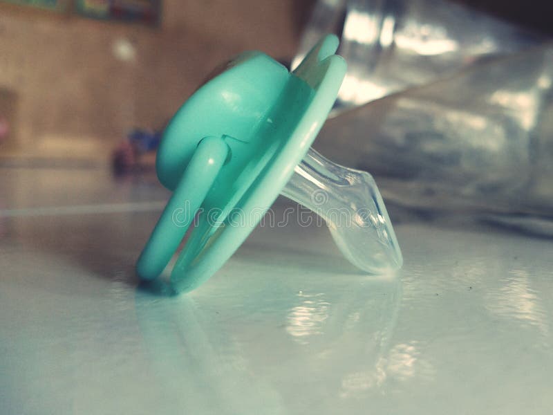 Baby pacifier mode stock image. Image of finger, purple 267636753