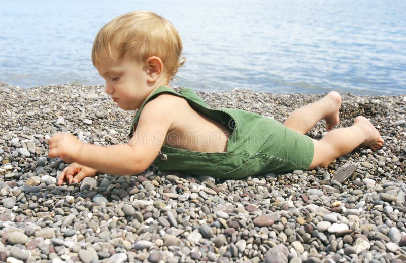 Baby on pebble beach