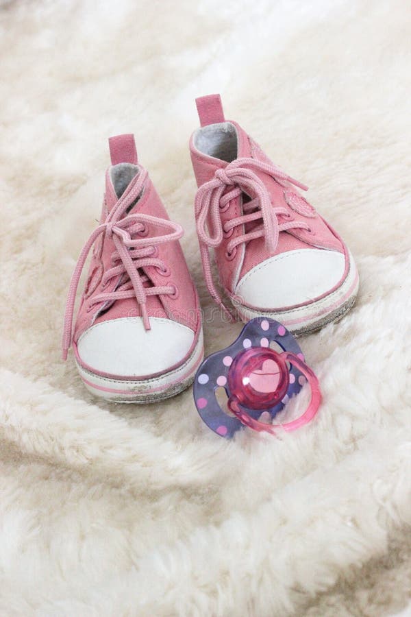 Baby pink shoes and dummy stock image. Image of baby 25011483