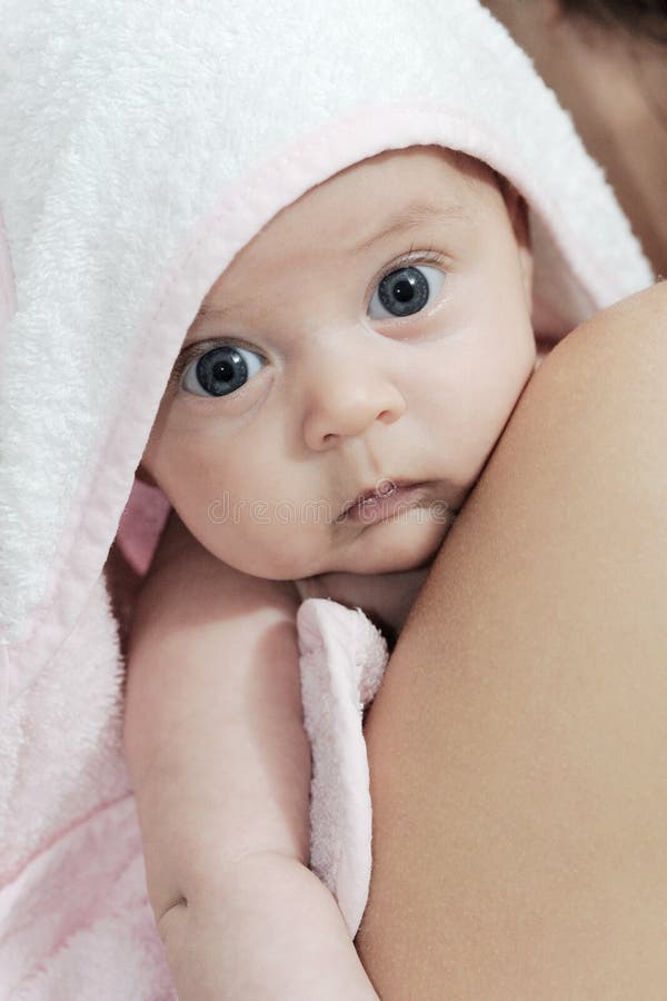 Baby in the pink and white bathrobe