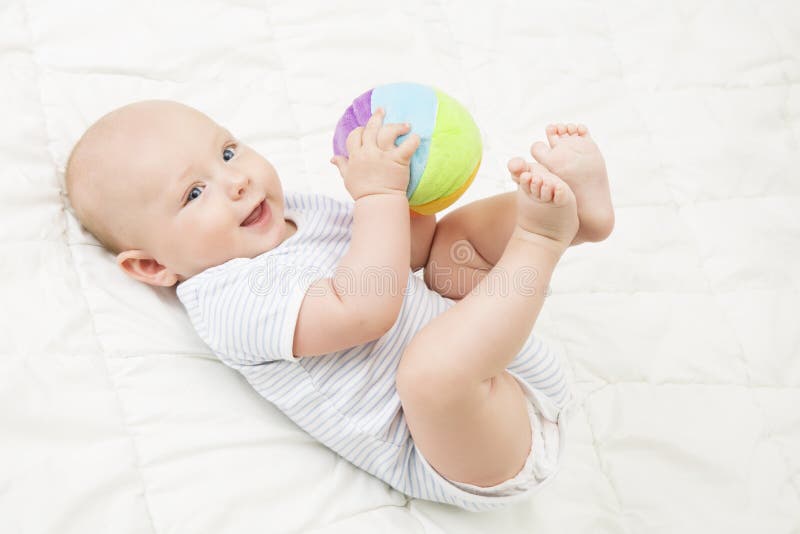 Baby Play Toy Ball, Happy Kid Lying on Back Playing Soft Toys