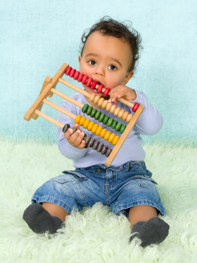Baby playing with abacus stock images Baby playing with abacus stock images