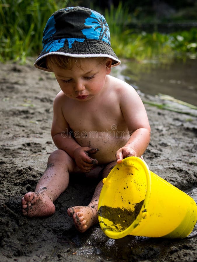 Baby playing on beach stock photo Baby playing on beach stock photo