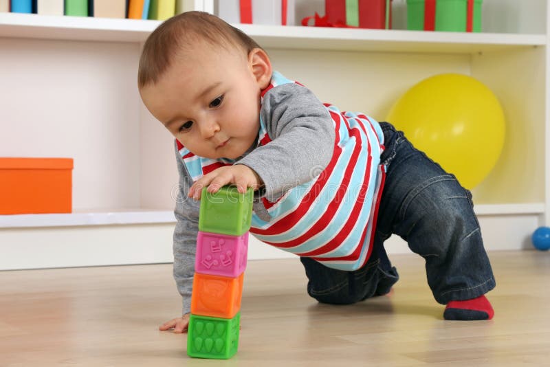 Baby playing with cubes royalty free stock photo