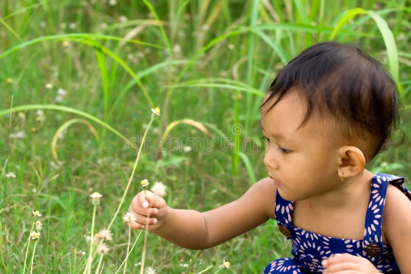 Baby playing in nature