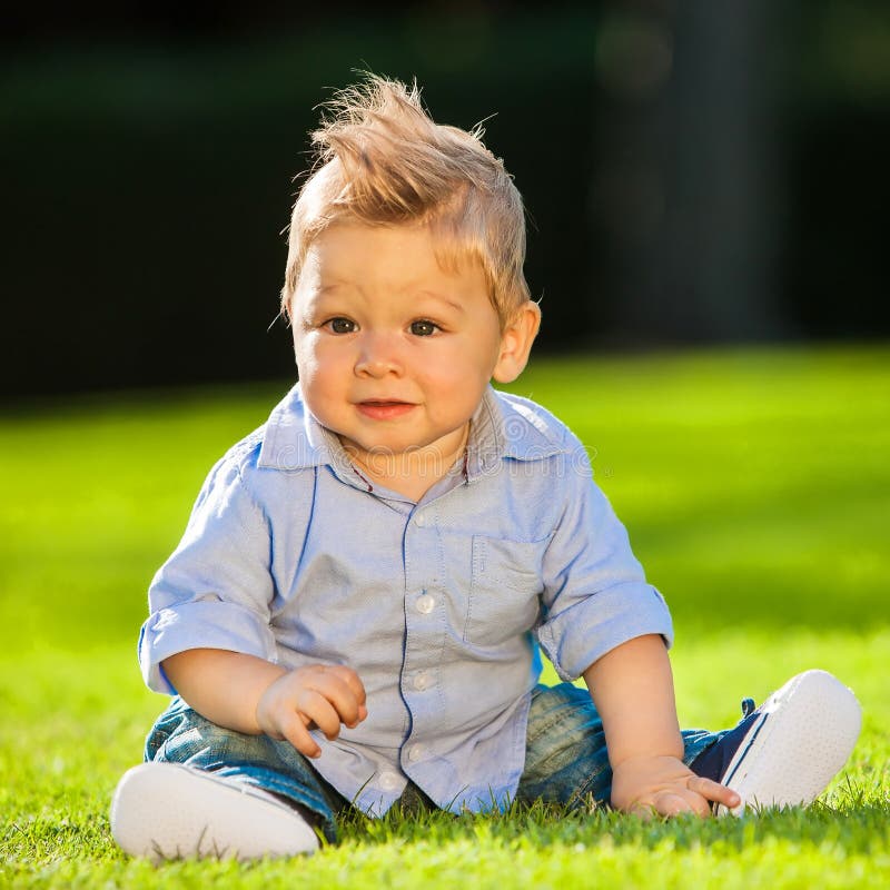 Baby playing on the grass stock image. Image of cheerful - 30920653