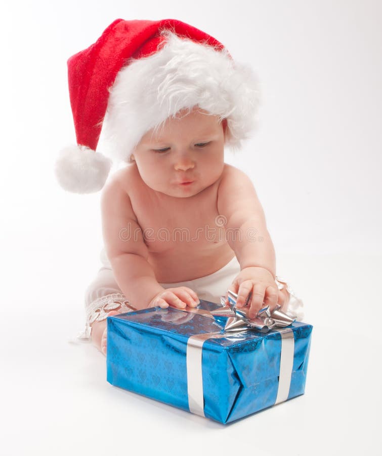 Baby playing with present box