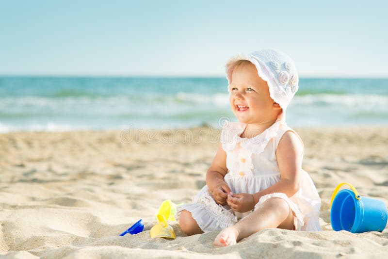 Baby playing at the sea