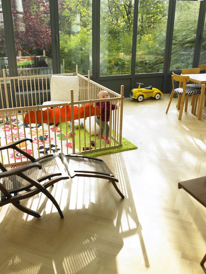 Baby in Playpen in Living Room Stock Image Image of indoors, furniture 12021431
