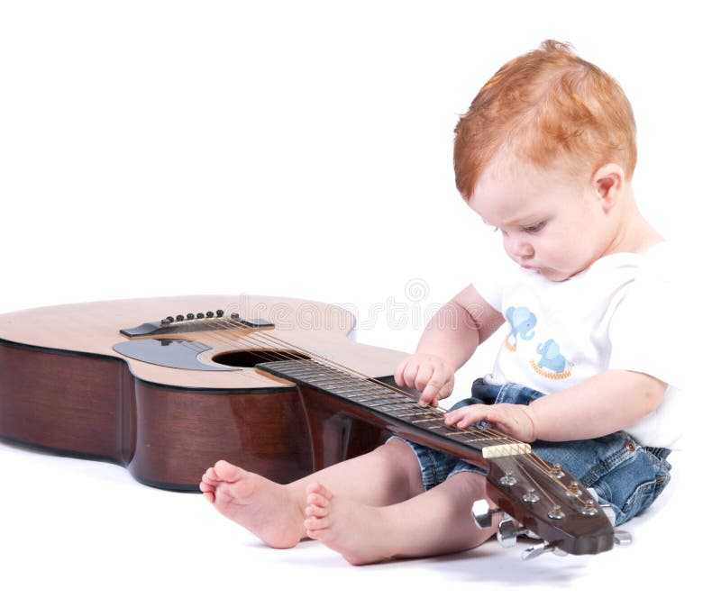 Baby plays guitar stock image. Image of melody, concert 30509671