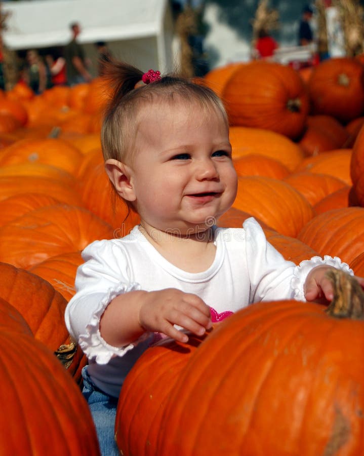 Baby in Pumpkin Patch
