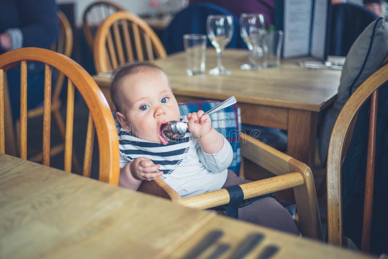Baby in a restaurant stock image. Image of lunch, girl, seat 35737