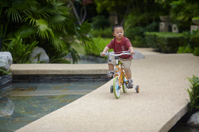 Baby riding bicycle stock image. Image of china, chongqing 72128531