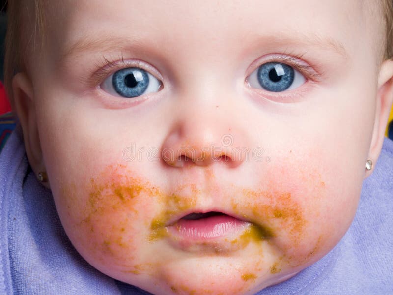 Baby with food on face