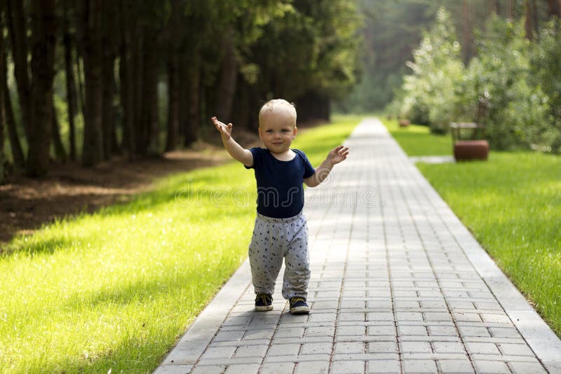 Baby`s First Steps.the First Independent Steps. Cute Boy on the Walk Stock Image Image of