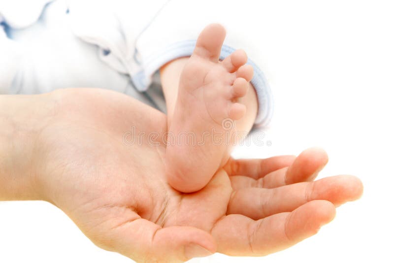 Baby s foot on parents  hand