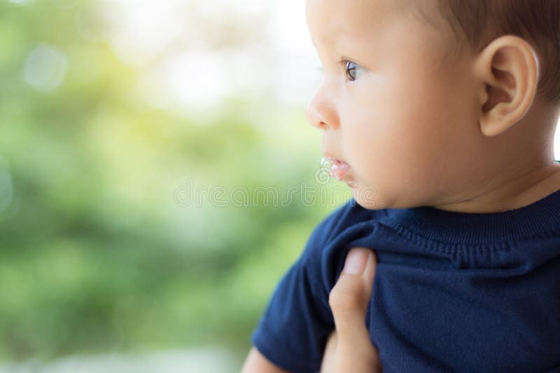 Baby with saliva, asian newborn.