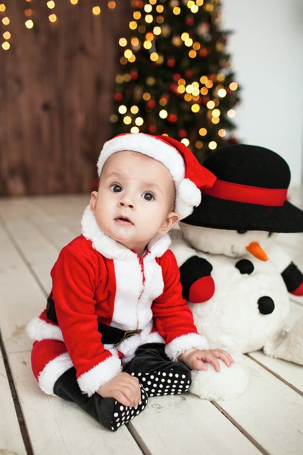 Baby in Santa Suit on the Floor Near Xmas Tree Stock Image - Image of ...