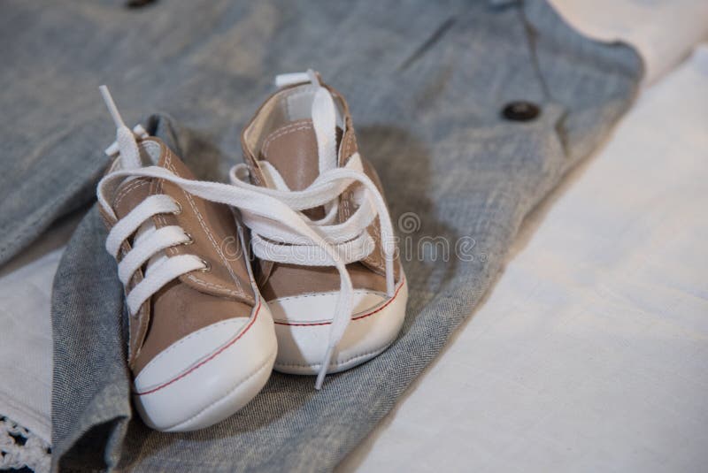 Baby shoes and clothes stock image. Image of baptism 61574537