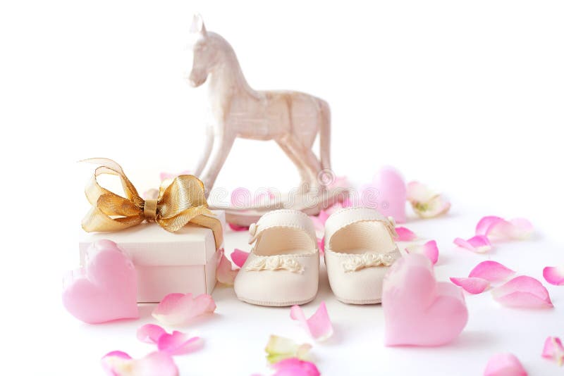 Baby shoes and gift stock photo