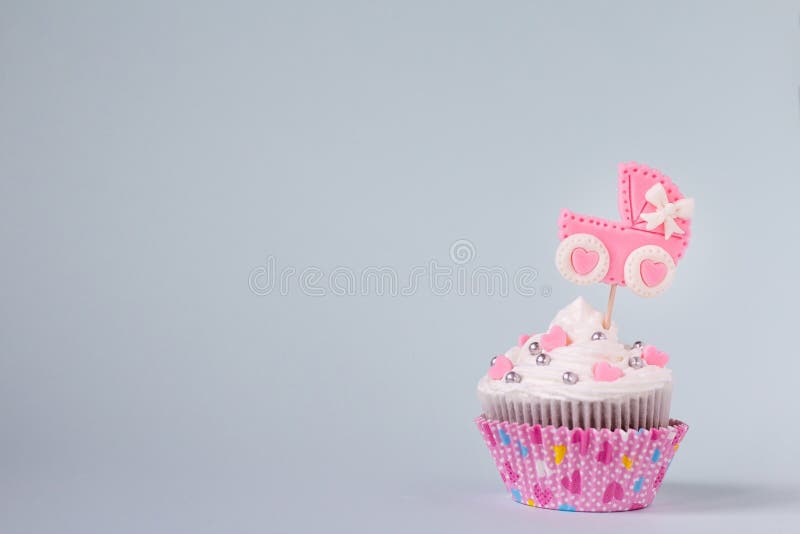 Baby shower cupcake for a girl. Newborn announcement concept. Text space