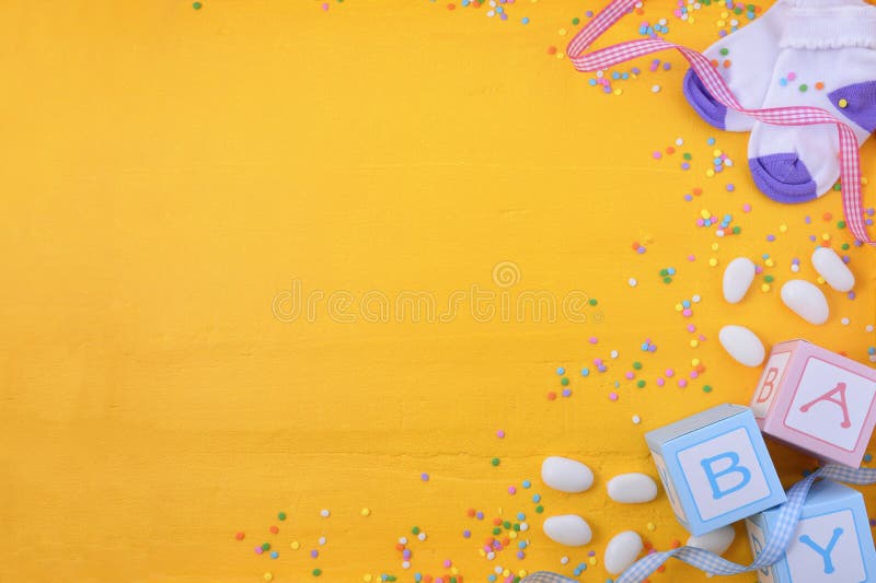 Baby Shower or Nursery background with decorated borders on a yellow wood background. Baby Shower or Nursery background with decorated borders on a yellow wood background.
