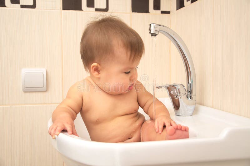 Baby in sink stock image. Image of bowl, cleanliness 46813113