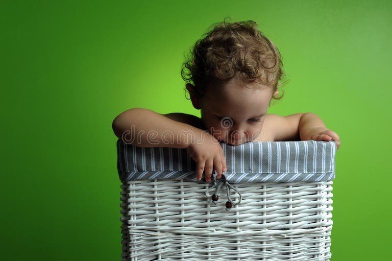 Baby sitting in a basket