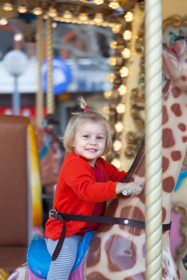 Baby Sitting On Carousel Giraffe Stock Photo Image Of Childhood