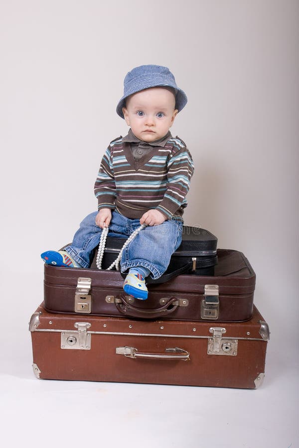 Baby in suitcase stock image. Image of cute, baggage 13460799