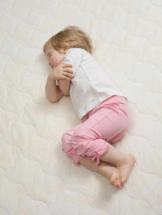 Baby sleeping on the bed stock photo. Image of childhood 30448070