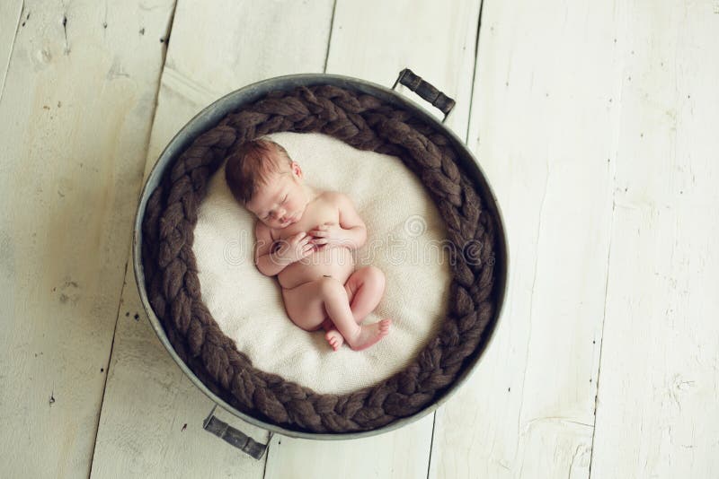 Baby sleeping in a tub