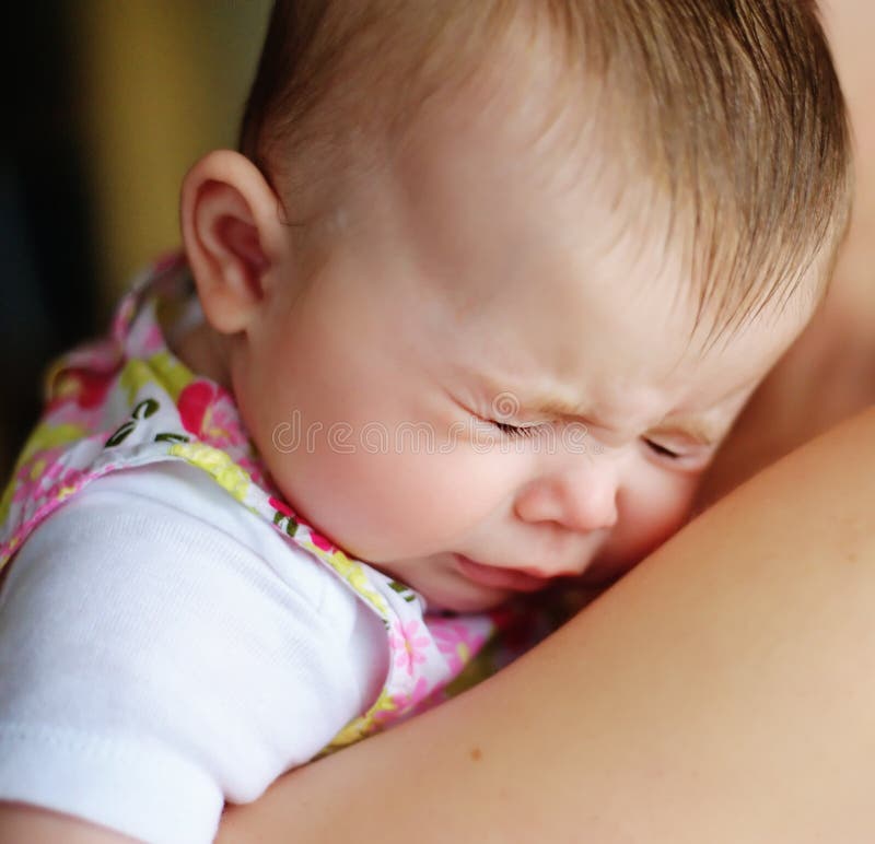 Baby sneezing stock image. Image of shoulder, child, innocent 16915047