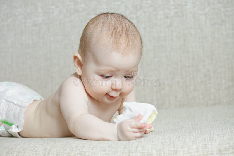 Baby with sock stock image. Image of sofa, newborn, caucasian 39518833