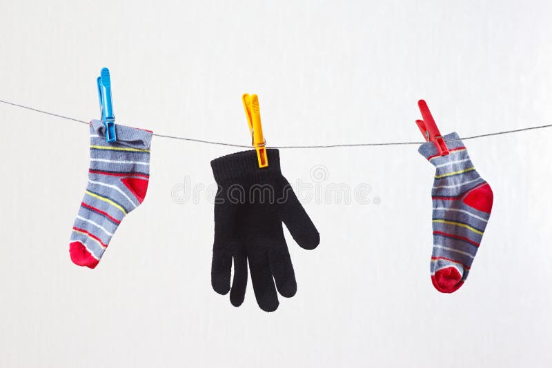 Baby Socks and Gloves are Drying on a Clothesline Stock Image Image