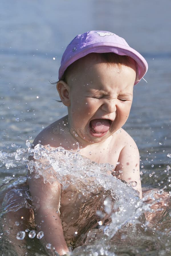 Download Baby splashing in water stock image. Image of splashes - 14821301