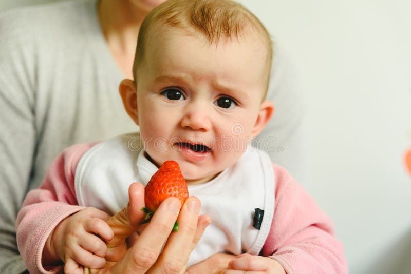 Baby Starting by Tasting a Strawberry Using the Baby Led Weaning BLW