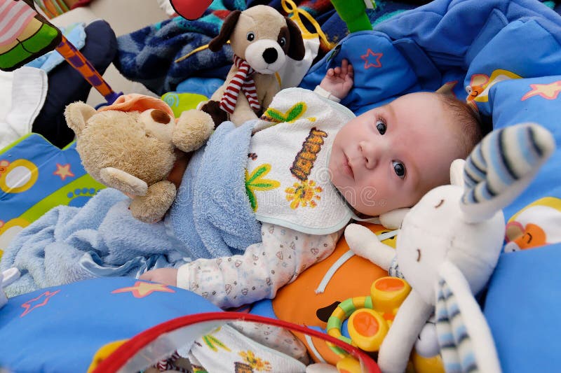 Baby surrounded by toys