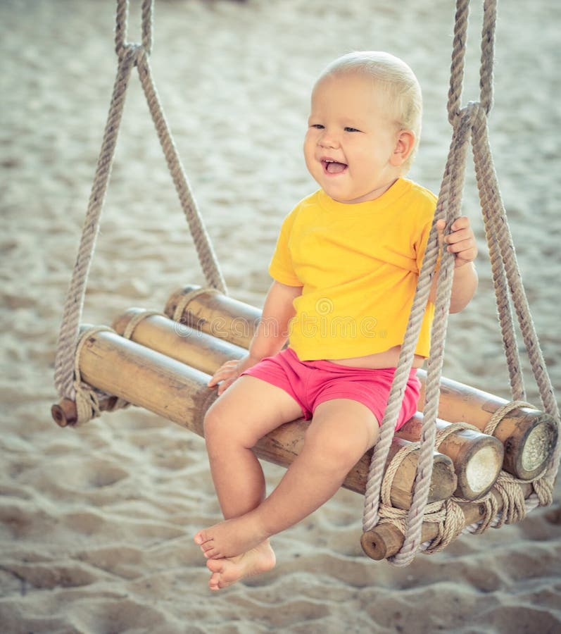Baby on a swing stock image. Image of love, bamboo, peaceful 50048207