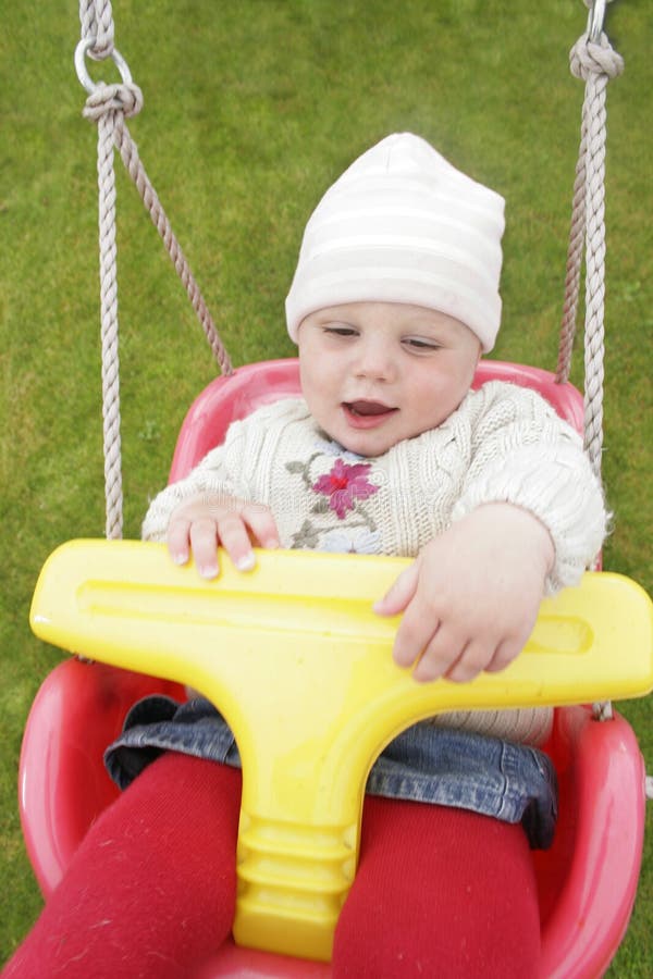 Baby swings stock photo. Image of play, swing, smile, garden 3346288