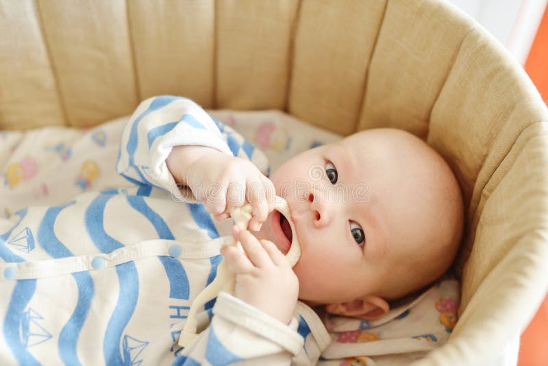 Baby with teether stock photography