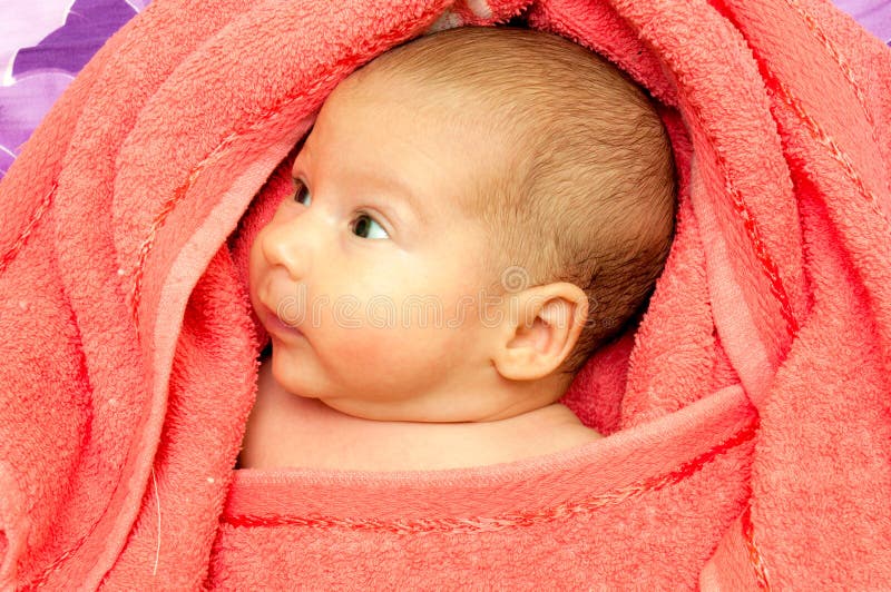 Baby in a towel stock image. Image of baby, expression 27525875