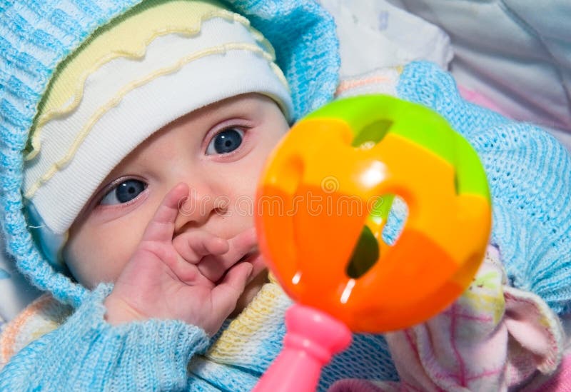 Baby and toy stock image. Image of rattle, outdoors, young - 16523253