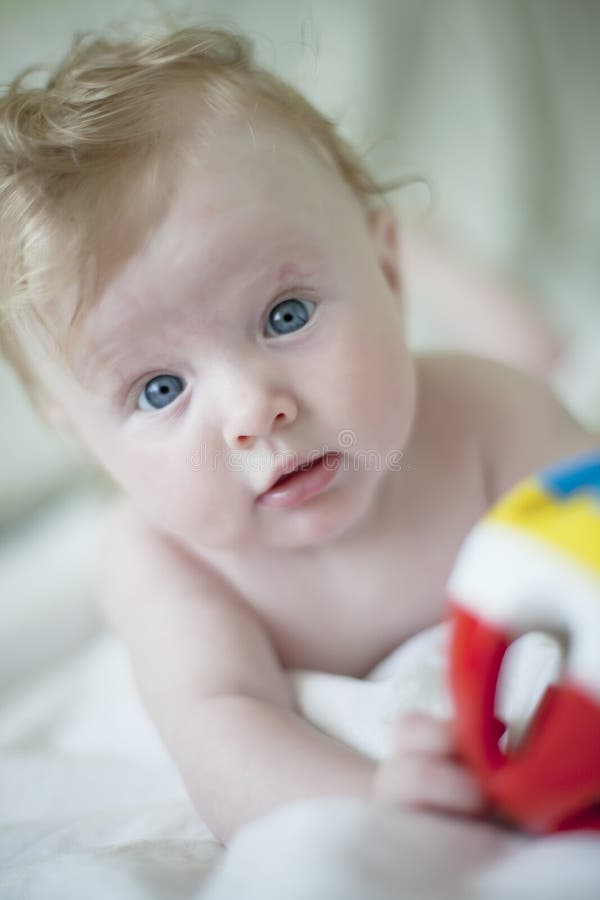 Baby with toy ball