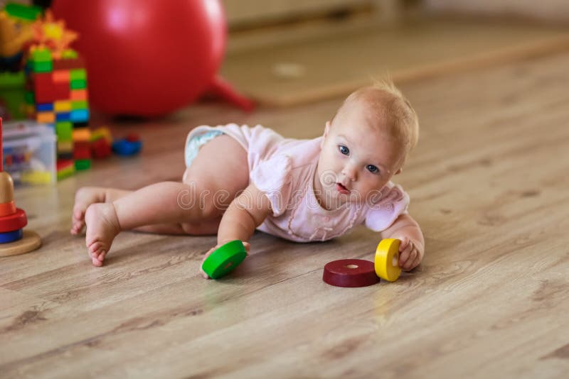 Baby with Toys on the Floor Stock Photo Image of interior, colored