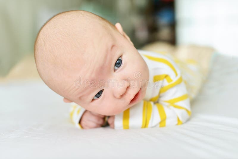 Baby trying to keep head stock photo. Image of child 138106374